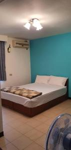Katil atau katil-katil dalam bilik di Ju Tong Homestay