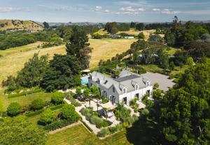 an aerial view of a large house in a field at Ranginui Retreat in Masterton