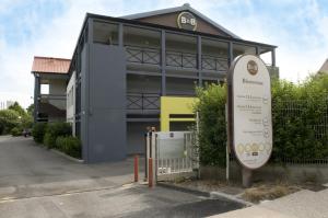 a building with a sign in front of it at B&B HOTEL Amiens in Longueau