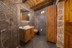 a bathroom with a sink and a shower and a toilet at Villa zeytin patara On the Lycian walking path in Kas