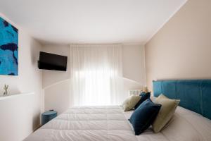 A bed or beds in a room at Moncada Suites & Apartments