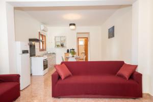 A kitchen or kitchenette at Afroditi Holiday Home - Yellow Apartment