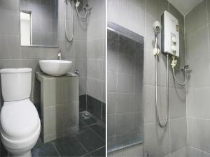 a bathroom with a shower and a toilet and a sink at OYO 89950 365 Nice Stay in Miri