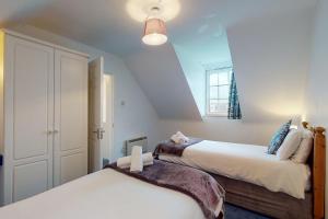 Ένα ή περισσότερα κρεβάτια σε δωμάτιο στο Dingle Holiday Homes