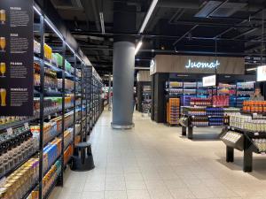 an empty aisle of a grocery store at 100m2 Luxury Skyscraper Apartment with Amazing view over Helsinki in Helsinki