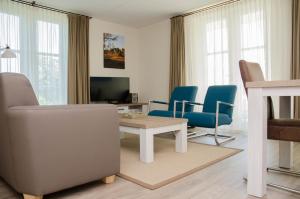 TV a/nebo společenská místnost v ubytování Hotel Graaf Bernstorff