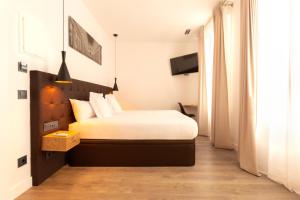 Posteľ alebo postele v izbe v ubytovaní Woohoo Rooms Fuencarral