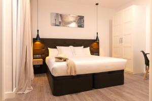 Posteľ alebo postele v izbe v ubytovaní Woohoo Rooms Fuencarral