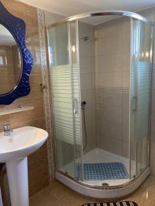 a bathroom with a shower and a sink at Kalives Sithonia Family house in Kalyves Poligirou