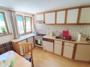 A kitchen or kitchenette at Pretty Holiday Home in Mayerhofen