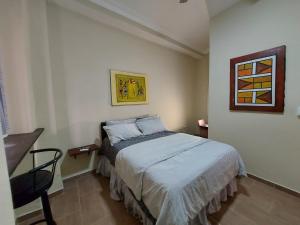 Postel nebo postele na pokoji v ubytování Casa Kamanda, Zona Colonial, Santo Domingo