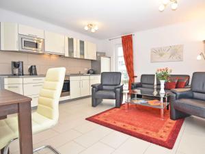 a living room with two chairs and a table at Dünenresidenz Königin Augusta - Apt. 07 in Binz