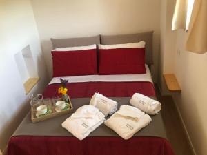 A bed or beds in a room at STAZZU LU CHISSONI