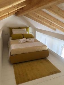 A bed or beds in a room at STAZZU LU CHISSONI