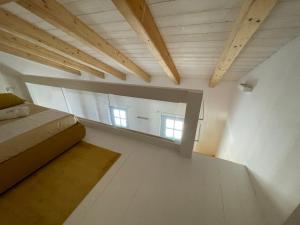 A bed or beds in a room at STAZZU LU CHISSONI