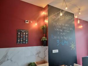 a chalkboard on the wall of a restaurant at La Trappiste in Liévin