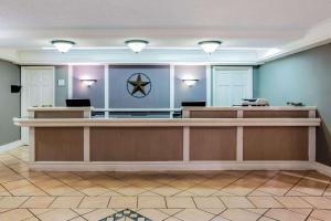 a lobby with a waiting room with a reception desk at Baymont by Wyndham Abilene in Abilene