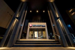 a best western plus building with stairs in front of it at Best Western Plus Fukuoka Tenjin-minami in Fukuoka