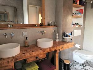 a bathroom with a sink and a toilet at B&B Egloff in Eaucourt-sur-Somme