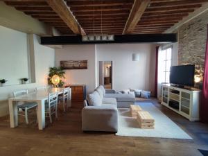 a living room with a couch and a table at Esquiros in La Ciotat