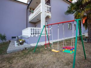 a playground in the yard of a house at Apartment Olivia by Interhome in Pićan