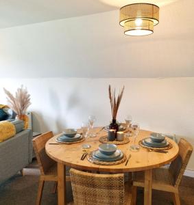 a dining room table with chairs and a dining room table at 19 the Coombe in Bude
