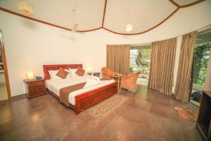 Postel nebo postele na pokoji v ubytování WOW Bison Woods Organic Veg Resort - Yercaud + 37 fotografií