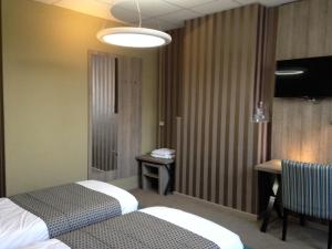 Letto o letti in una camera di Hotel Mille Colonnes