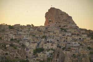 a group of white houses on a mountain at Karlık Cave Suite Cappadocia in Uçhisar