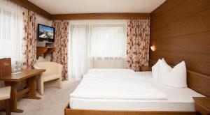 Letto o letti in una camera di Gasthof Talblick