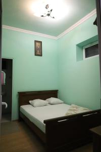 Postel nebo postele na pokoji v ubytování Tnak Hotel