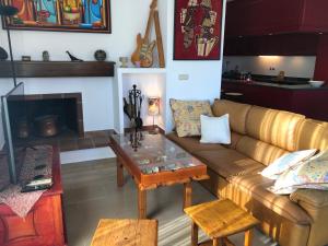 a living room with a couch and a coffee table at Loft acogedor con terraza y parking en el centro in Huesca