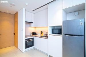 Kuchyň nebo kuchyňský kout v ubytování bnbmehomes - Jetset Life Style at Address Residences - 3908