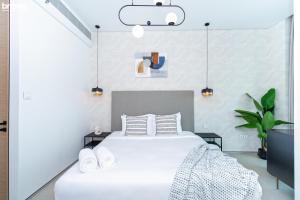 Katil atau katil-katil dalam bilik di bnbmehomes - Address Beach Resort