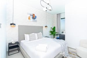 Katil atau katil-katil dalam bilik di bnbmehomes - Address Beach Resort