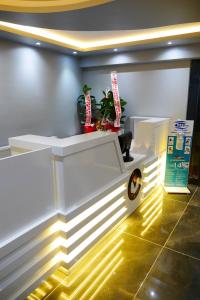 a white bench in a room with lights at dagkent plus suit in Tokat
