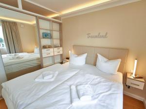 Postel nebo postele na pokoji v ubytování DünenResort Binz - Apt. 3.8