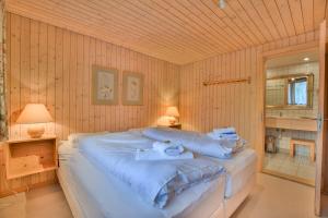 Postel nebo postele na pokoji v ubytování Chalet Arnica