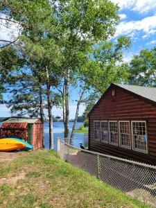 a house with a boat on the side of it at Butler's Bay Cottage cottage in Hayward