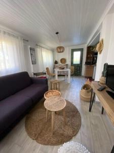 a living room with a couch and a table at Casa Francesca in Saint-Florent