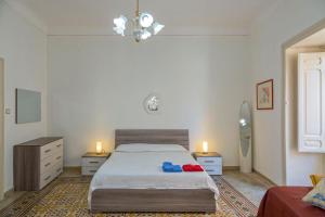 Postel nebo postele na pokoji v ubytování Casa di Anna - Appartamento nel cuore di Ortigia