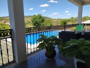 a balcony with a view of a pool at Vivenda das Eiras in Vale de Porco