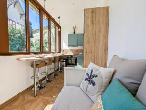 a living room with a couch and a table at La Maison T&M in Dosches