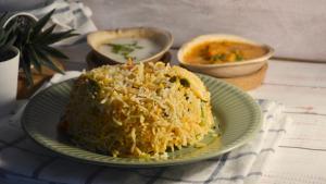 a plate of food with rice on a table at Udipi's Vihar in Hyderabad