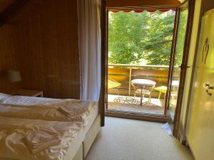Кровать или кровати в номере AmdenLodge - Gardens Chalet