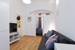 Televízia a/alebo spoločenská miestnosť v ubytovaní Pat & Mat Apartment