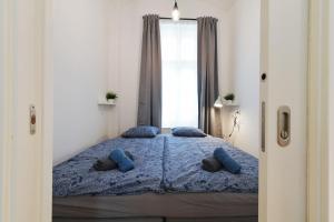 Posteľ alebo postele v izbe v ubytovaní Pat & Mat Apartment