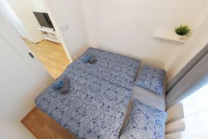 Posteľ alebo postele v izbe v ubytovaní Pat & Mat Apartment