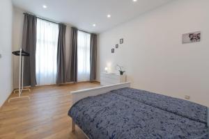 Posteľ alebo postele v izbe v ubytovaní Pat & Mat Apartment