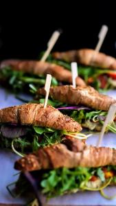 a group of sandwiches with wooden sticks in them at Apartament 11A- Hvile in Toruń